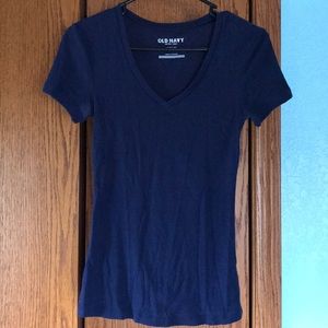 V-neck navy blue shirt.